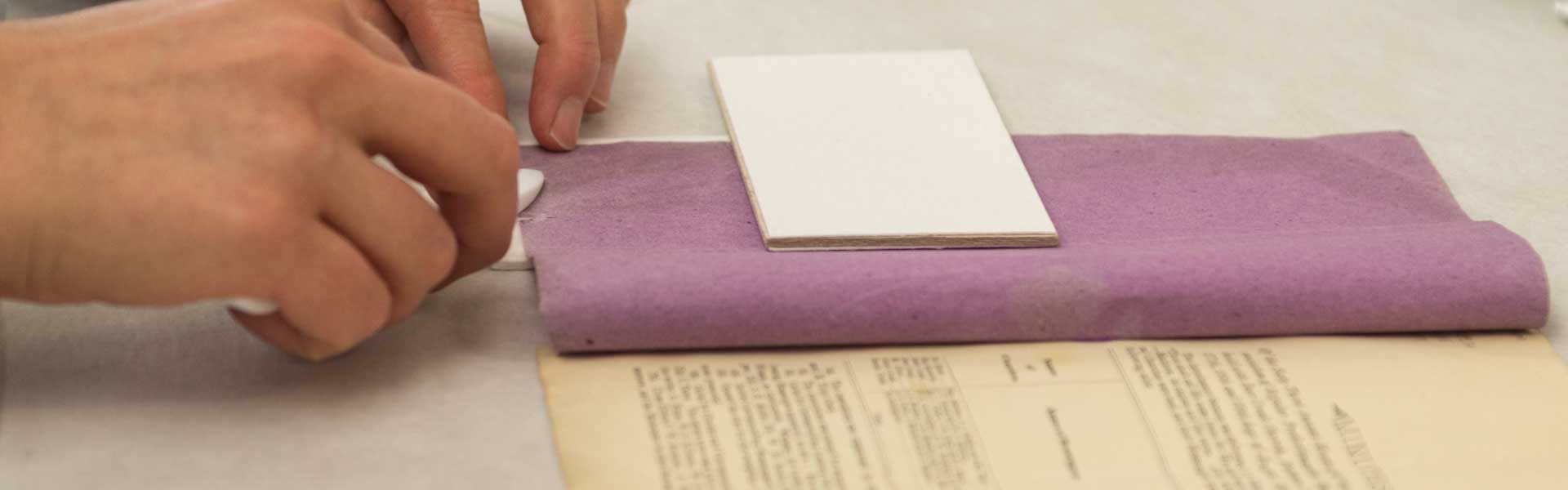 Conservator working on a mending project.